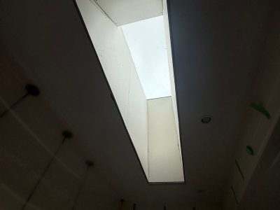 Steel City Drywall contractor repairing a wall in Victoria, BC