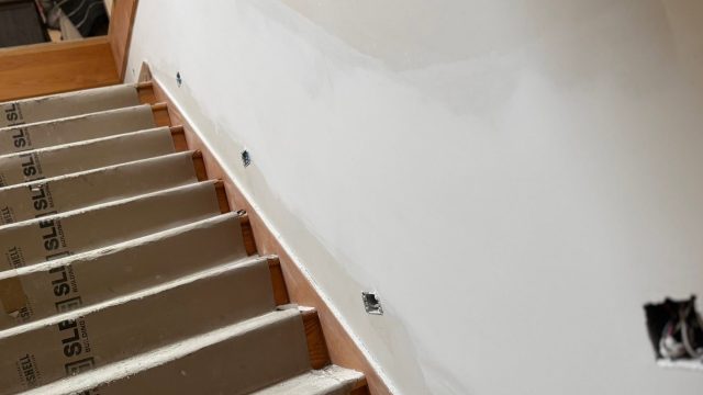 Taped and finished drywall along a staircase in a Victoria, BC home